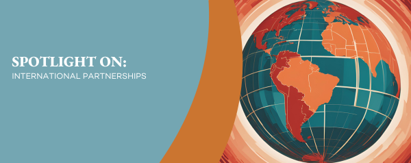Spotlight on: International Partnerships. Decorative image of a globe in blue, red, and orange.