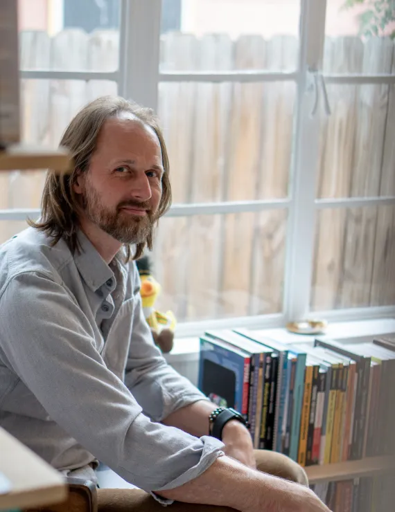 Dan sitting in office