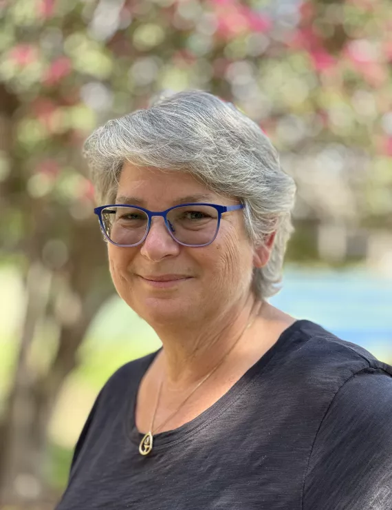 Photo of a white woman with short grey hair and glasses